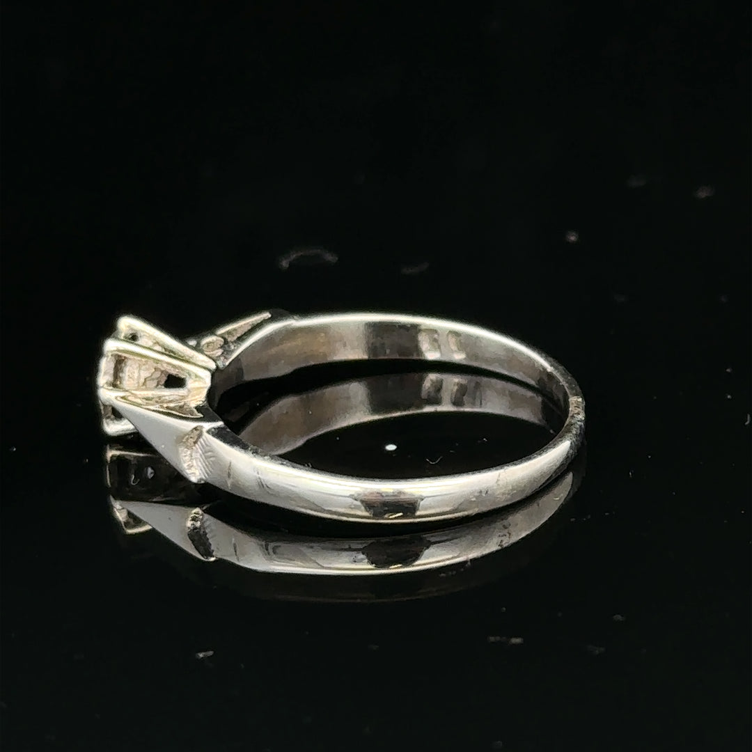 9ct white gold diamond ring with sparkling gemstones, showcasing elegant design and craftsmanship.