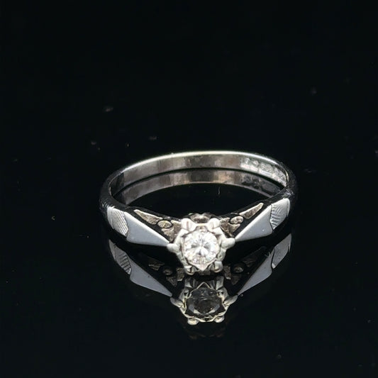 9ct white gold diamond ring with sparkling diamonds, showcasing elegant craftsmanship and a classic design.