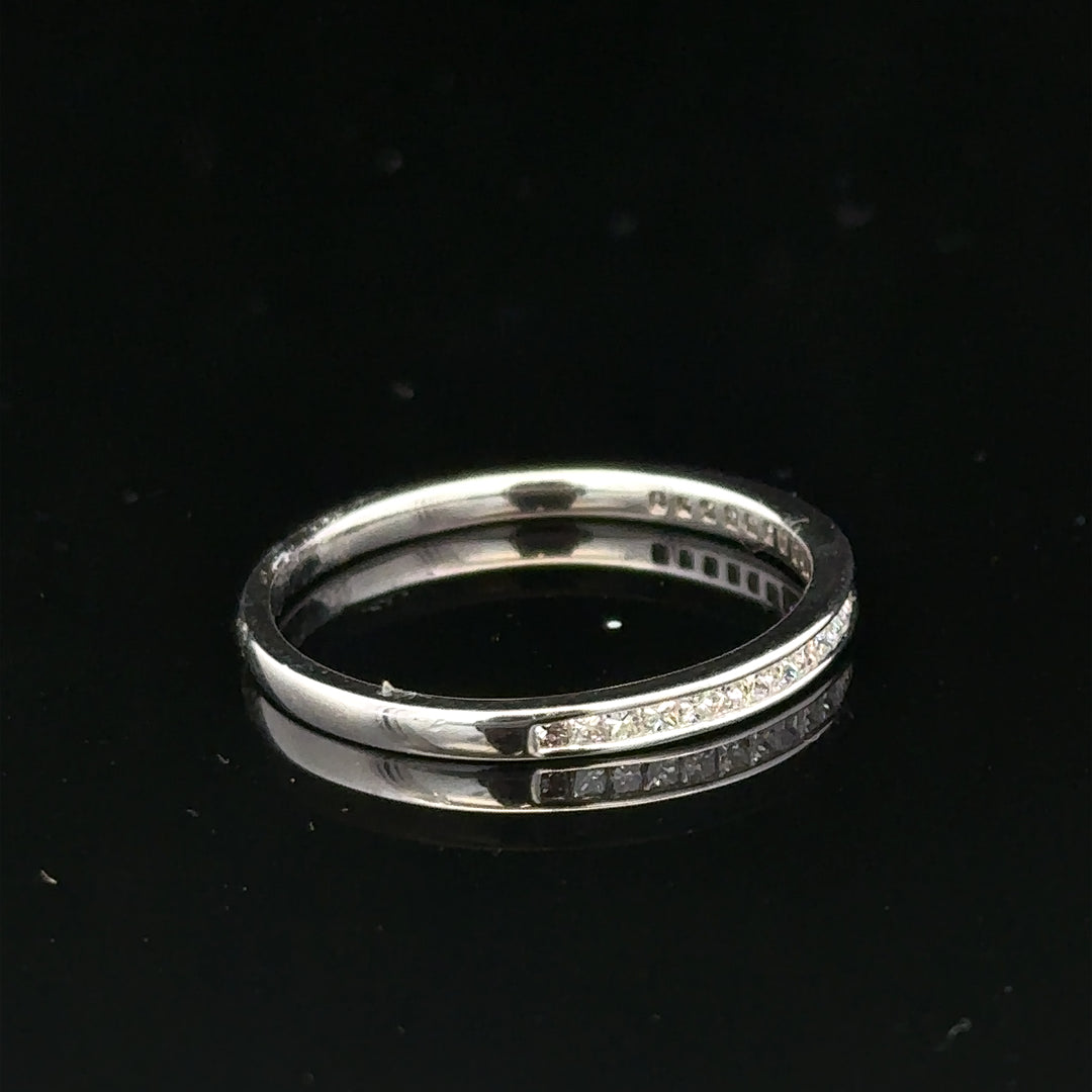 18ct white gold diamond ring in size Q1/2 with sparkling diamonds, unbranded, shown from an angled view.