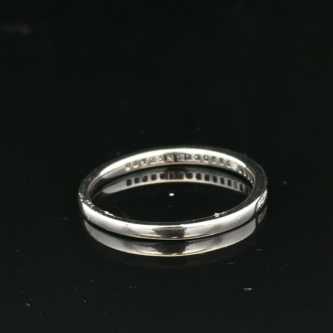 18ct white gold diamond ring size Q1/2 with sparkling diamonds, unbranded jewelry piece, shown close-up on a plain background.