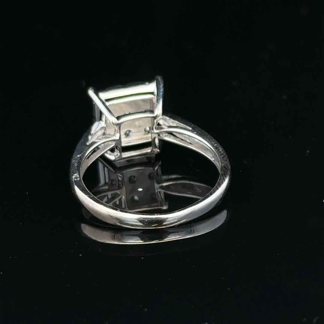 9ct white gold half carat diamond ring with a central diamond and elegant band, showcasing fine jewelry craftsmanship.