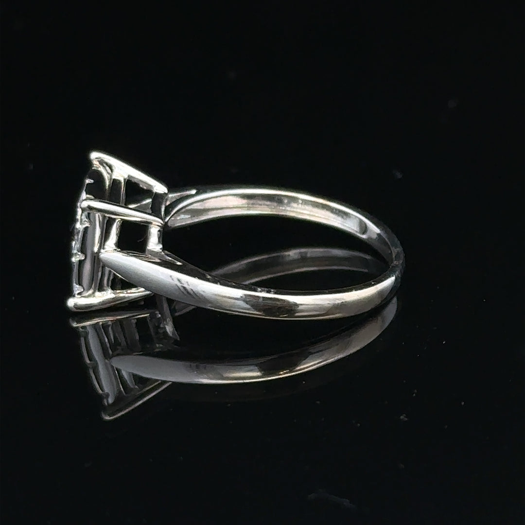 9ct white gold half carat diamond ring with a central diamond and delicate band, showcasing fine jewelry craftsmanship.