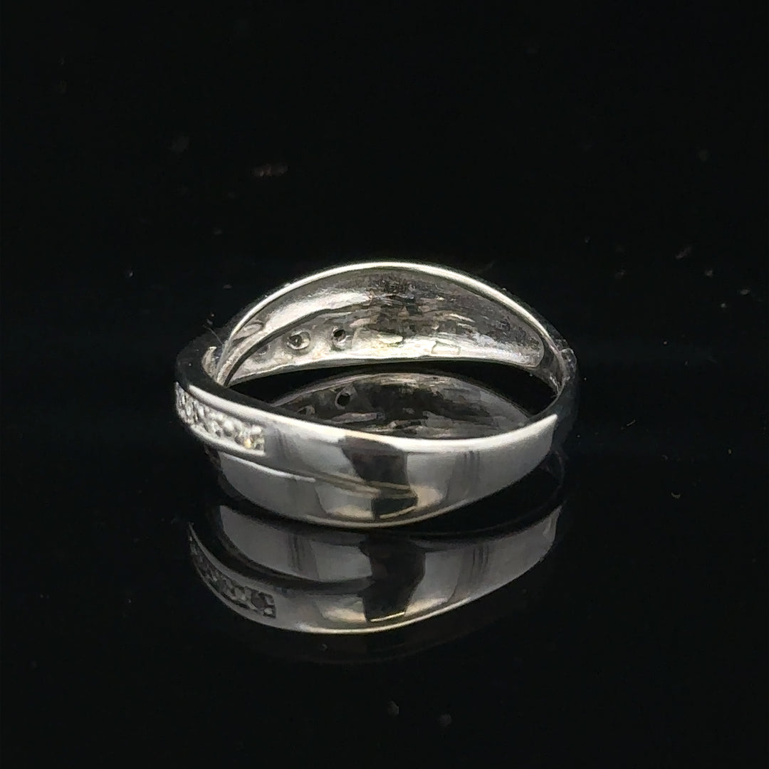9ct white gold diamond ring in size J1/2 featuring a sparkling diamond centerpiece on a sleek band.
