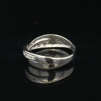 9ct white gold diamond ring in size J1/2 featuring a sparkling diamond centerpiece on a sleek band.