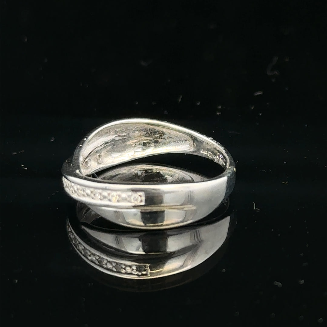 9ct white gold diamond ring size J1/2 with sparkling diamonds, showcasing elegant craftsmanship and refined jewelry design.