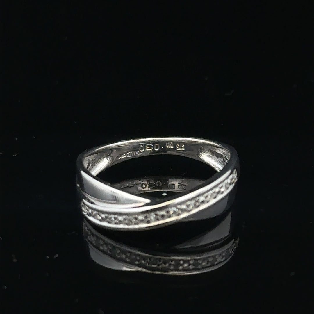 9ct white gold diamond ring size J1/2 with sparkling diamonds, showcasing elegant jewelry design and craftsmanship.