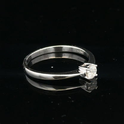 18ct white gold diamond ring with 1/4 carat diamond, size P1/2, featuring a sleek, elegant design.