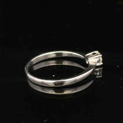 18ct white gold diamond ring with 1/4 carat diamond, size P1/2, featuring a sleek and elegant design.