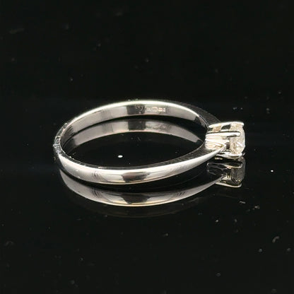 18ct white gold diamond ring with 1/4 carat diamond, size P1/2, featuring a sleek and elegant design.