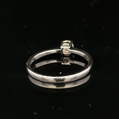 18ct white gold diamond ring with 1/4 carat total weight, size P1/2, featuring a sparkling diamond centerpiece.