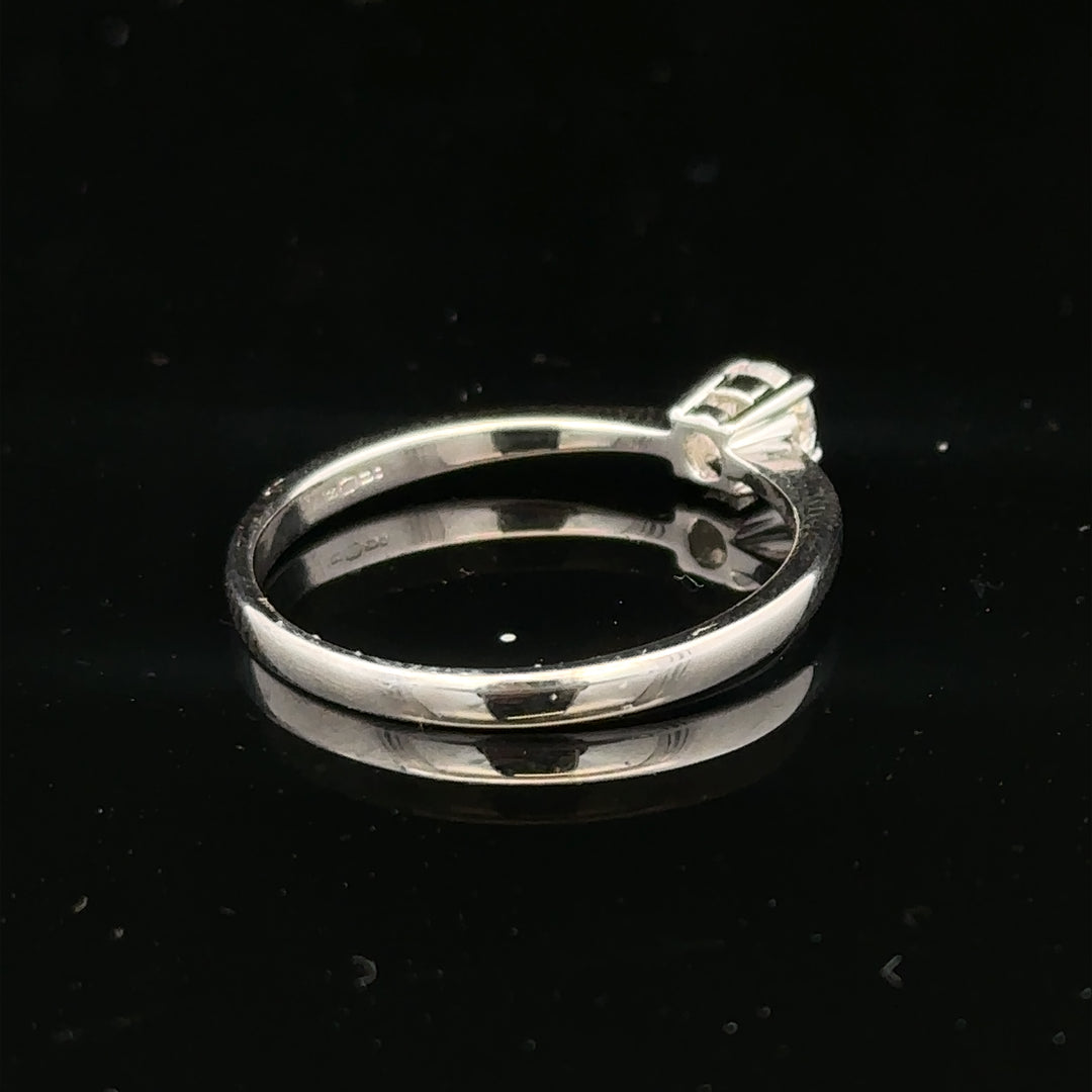 18ct white gold diamond ring with 1/4 carat round cut diamond in size P1/2, elegant jewelry piece with fine detailing.