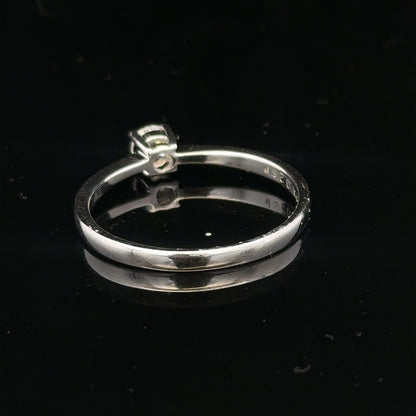 18ct white gold diamond ring with 1/4 caret center stone, size P1/2, featuring a sleek, elegant design.