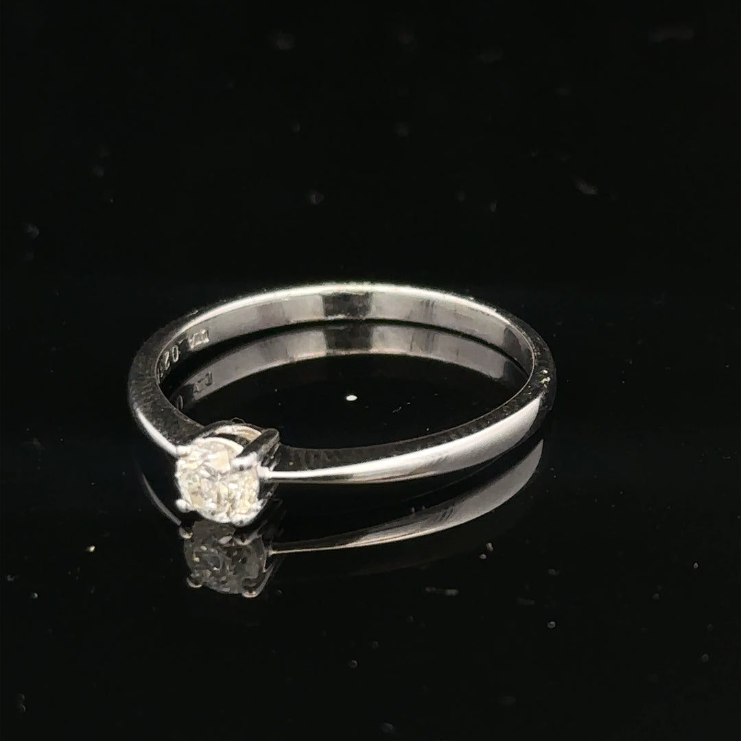 18ct white gold diamond ring with 1/4 carat diamond, size P1/2, featuring a sleek band and sparkling gemstone.