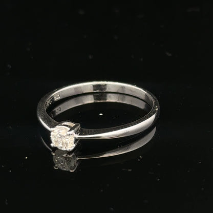 18ct white gold diamond ring with 1/4 carat diamond, size P1/2, featuring a sleek band and sparkling gemstone.