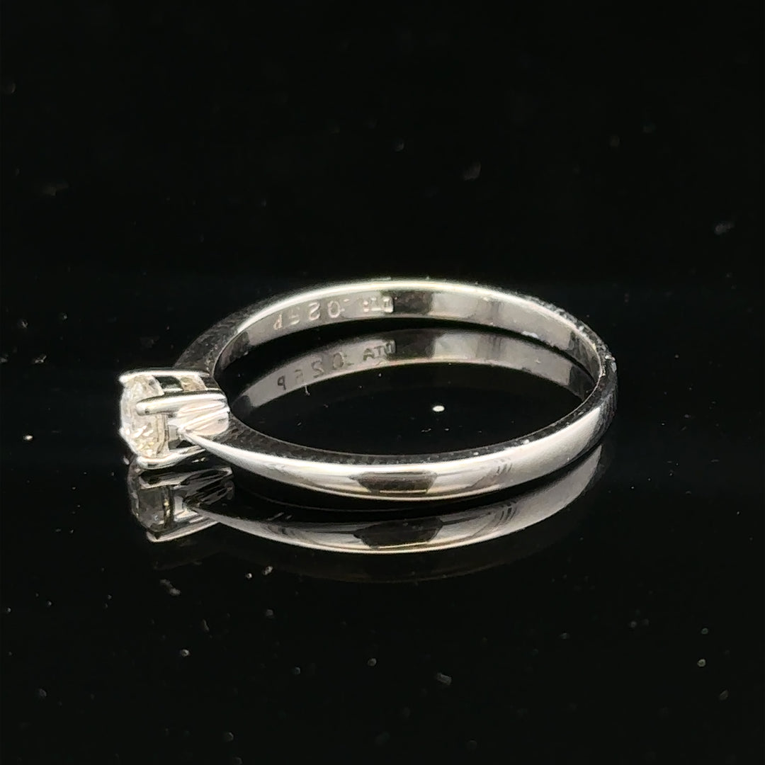 18ct white gold diamond ring with 1/4 carat solitaire, size P1/2, featuring a sparkling diamond setting.