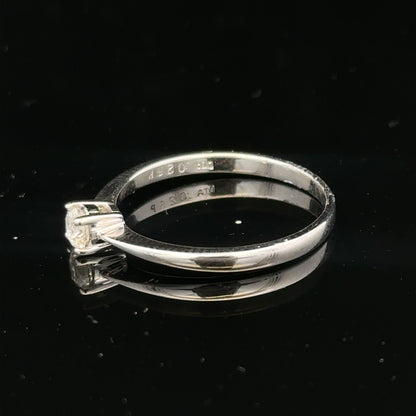 18ct white gold diamond ring with 1/4 carat solitaire, size P1/2, featuring a sparkling diamond setting.