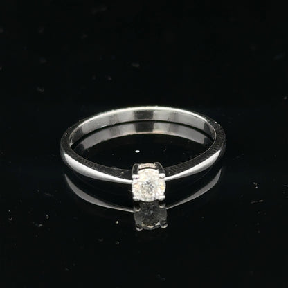 18ct white gold diamond ring with 1/4 carat center stone, size P 1/2, featuring a sleek and elegant design.