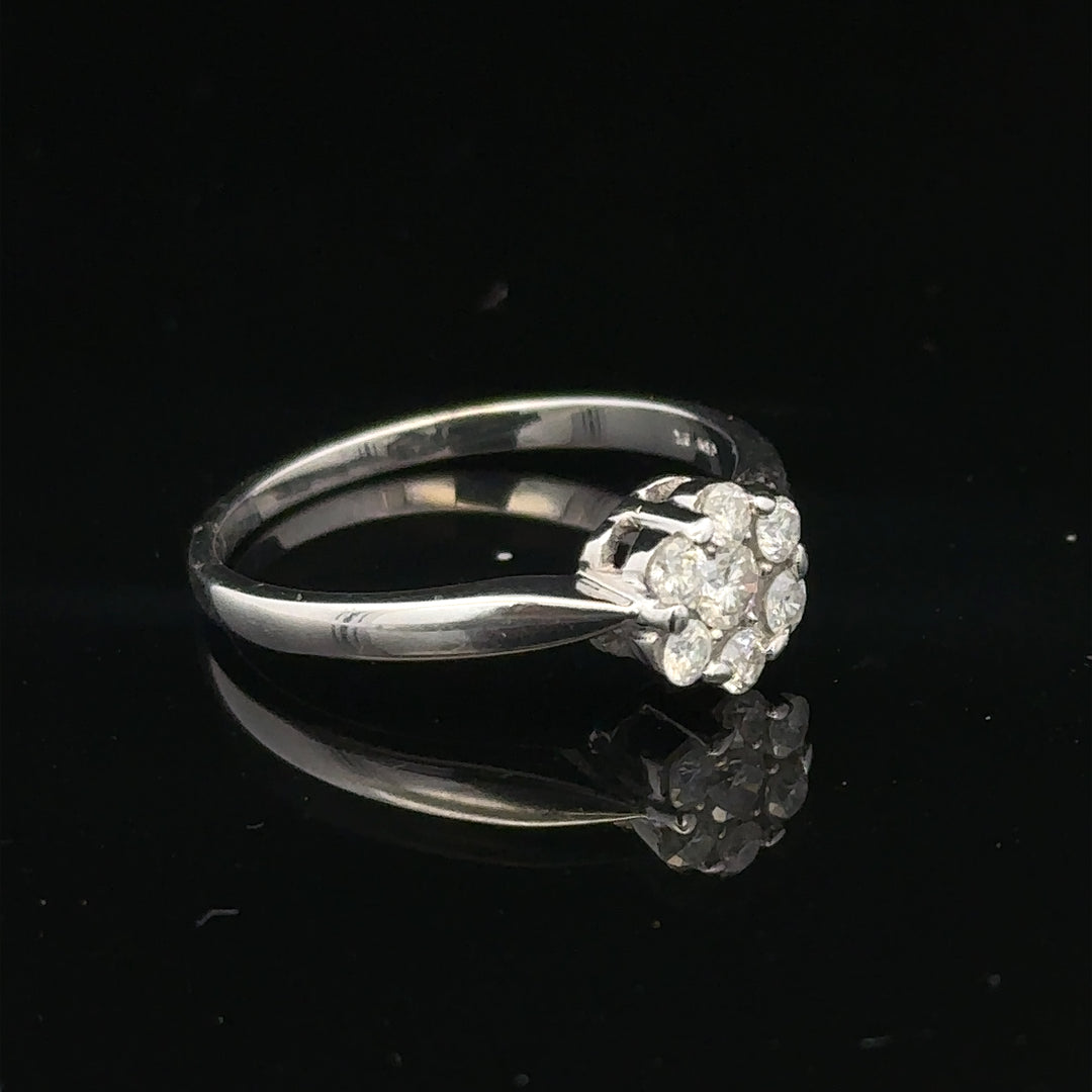 9ct white gold diamond cluster ring size O 1/2 with sparkling diamond accents, elegant jewelry piece.