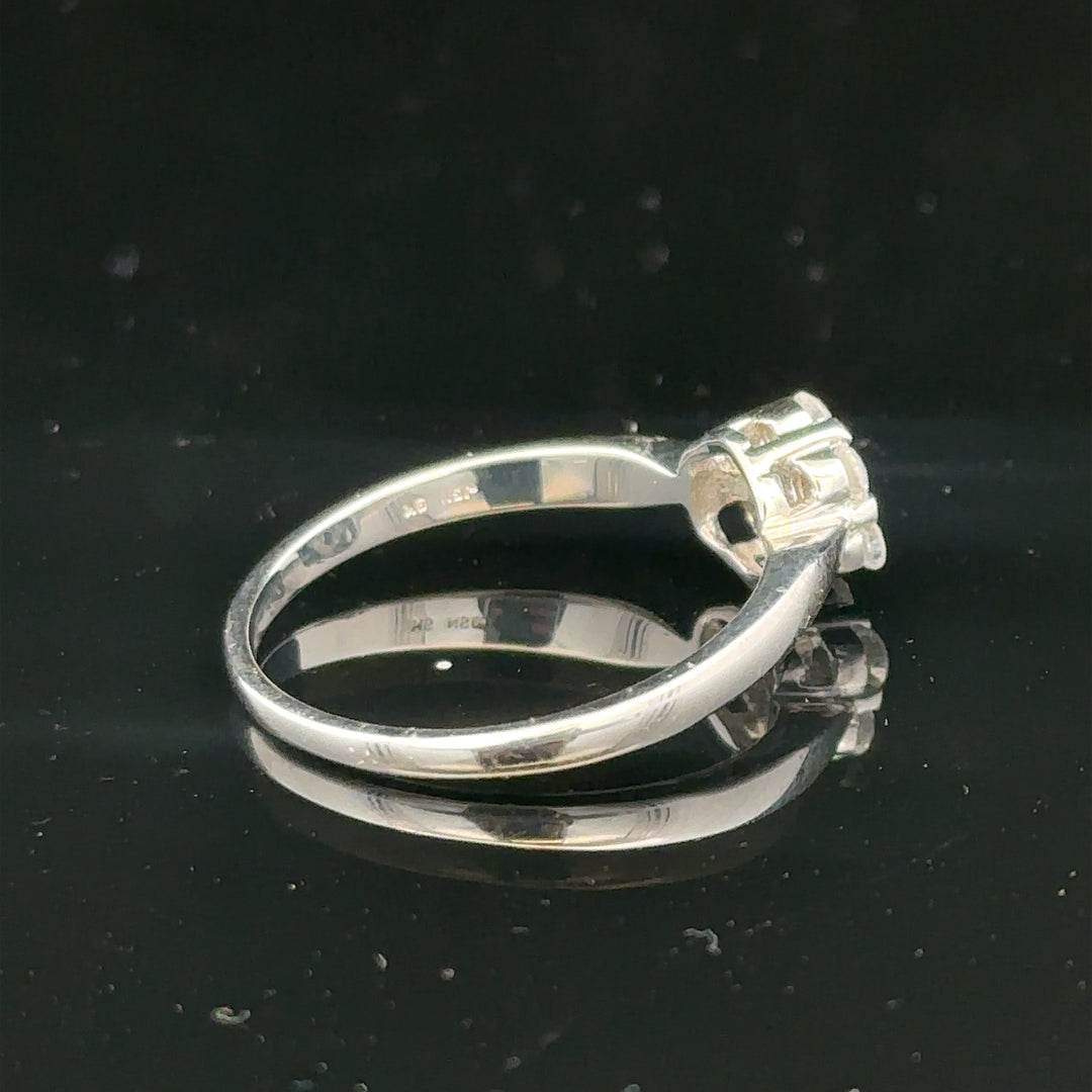 9ct white gold diamond cluster ring size O 1/2 with sparkling diamonds arranged in a floral design.