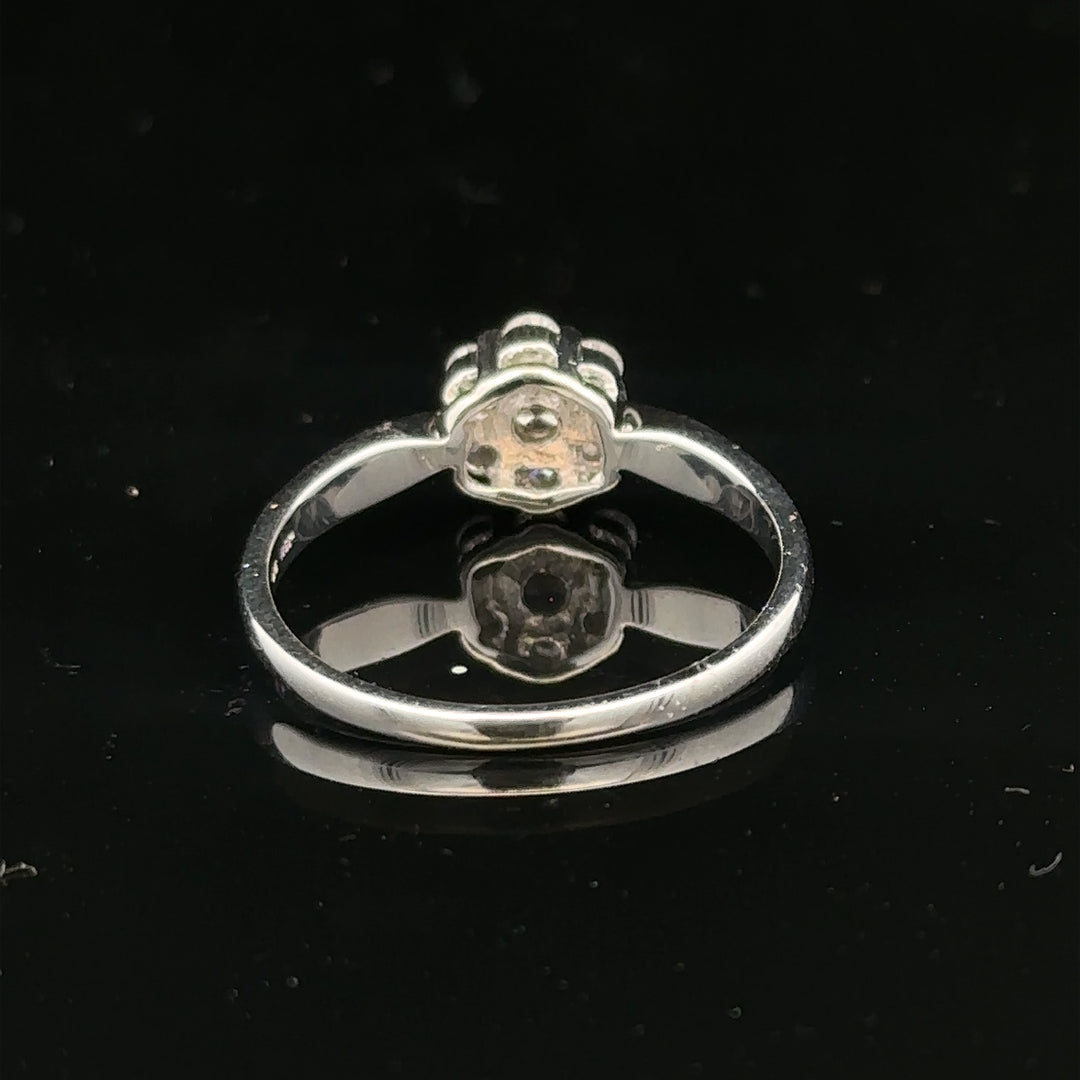 9ct white gold diamond cluster ring size O 1/2 with sparkling diamond accents, showcasing elegant jewelry design.