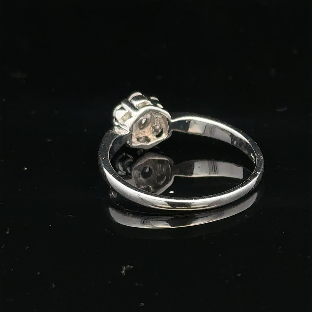9ct white gold diamond cluster ring size O 1/2, featuring a sparkling diamond design, shown from a front view.