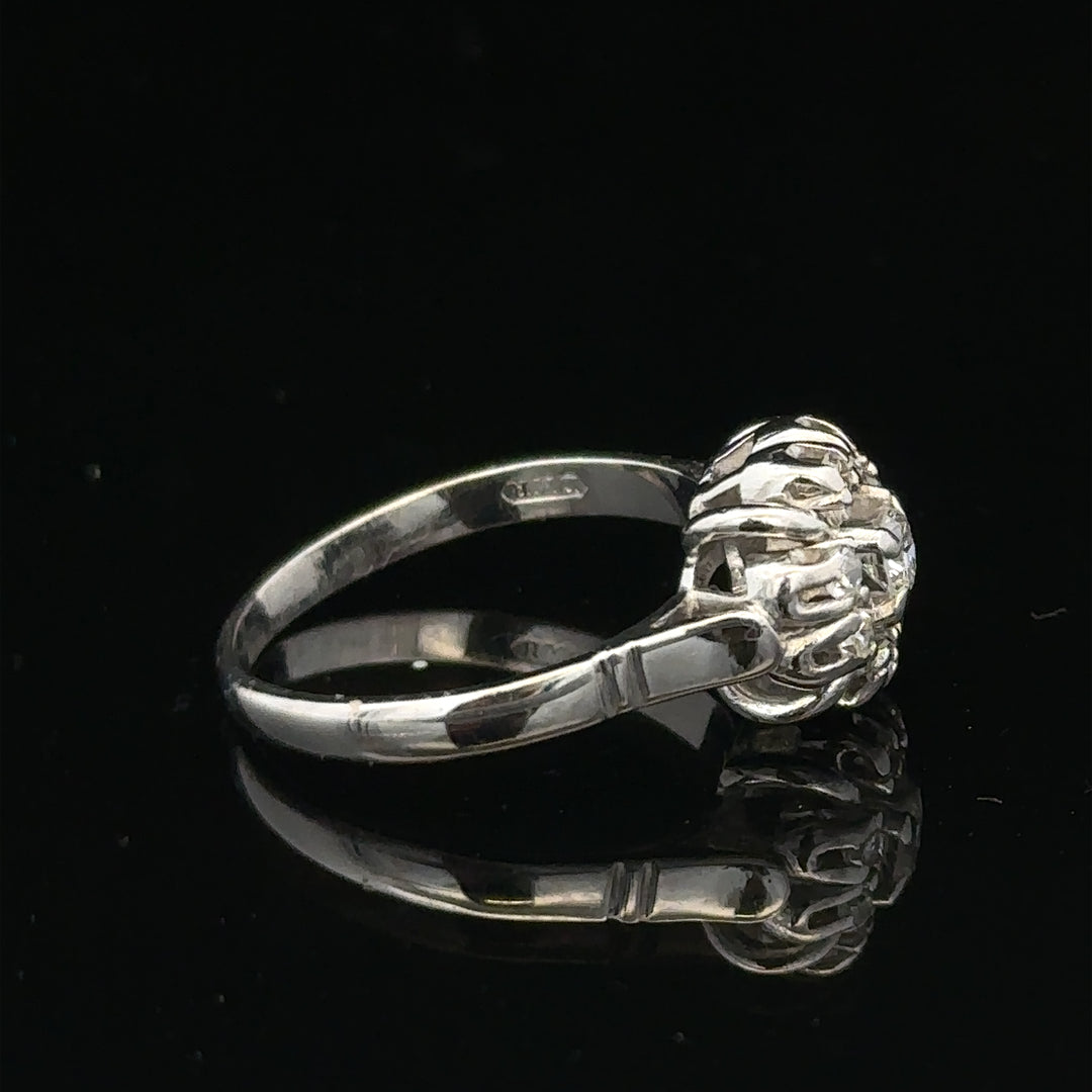 9ct white gold cluster diamond ring by Reeves and Sons featuring a sparkling diamond design.