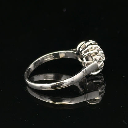 9ct white gold cluster diamond ring by Reeves and Sons with sparkling diamonds and a elegant design.