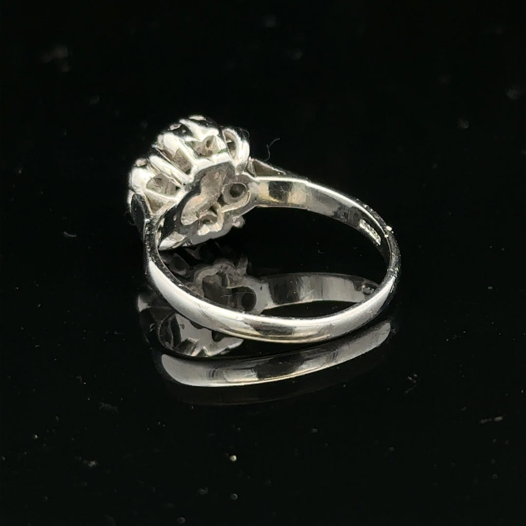 9ct white gold cluster diamond ring by Reeves and Sons featuring multiple sparkling diamonds in a elegant design