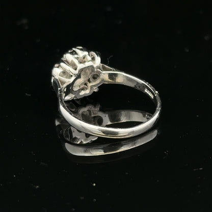 9ct white gold cluster diamond ring by Reeves and Sons featuring multiple sparkling diamonds in a elegant design