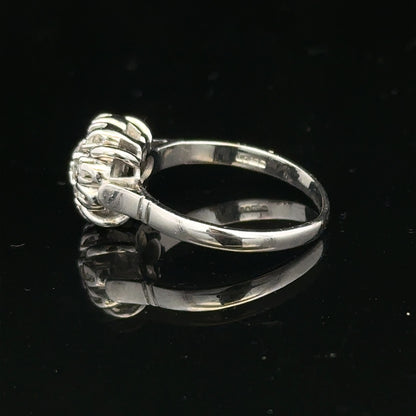 9ct white gold cluster diamond ring by Reeves and Sons featuring sparkling diamonds arranged in a elegant design.