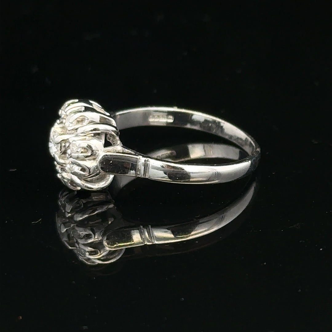 9ct white gold cluster diamond ring by Reeves and Sons, featuring a sparkling diamond cluster design.