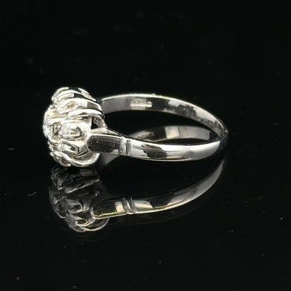 9ct white gold cluster diamond ring by Reeves and Sons, featuring a sparkling diamond cluster design.