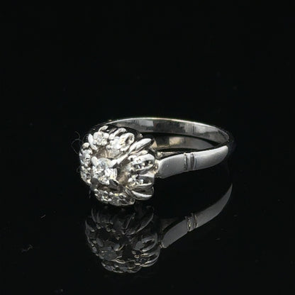 9ct white gold cluster diamond ring by Reeves and Sons, featuring sparkling diamonds set in a elegant design.