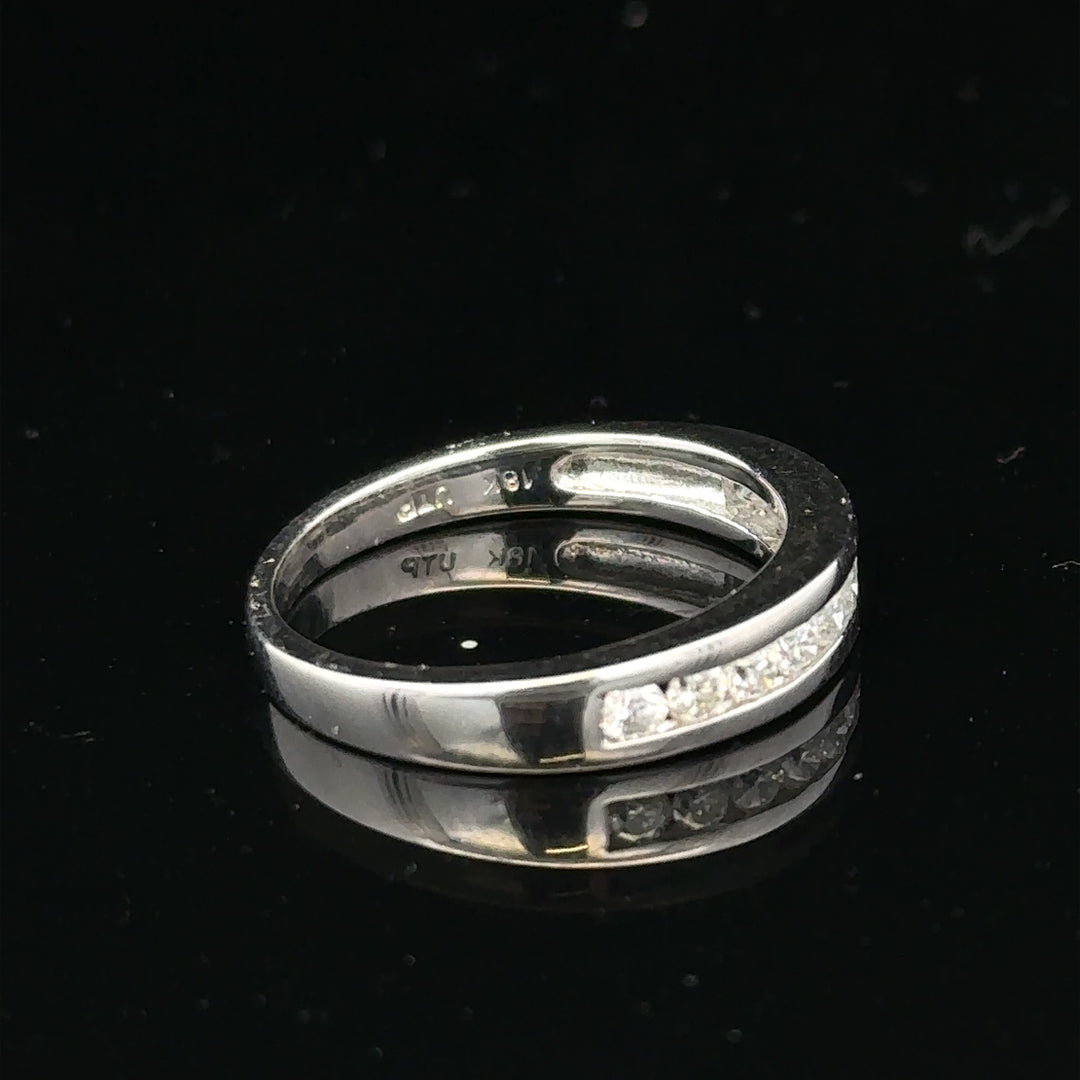 18ct white gold diamond ring in size L with sparkling diamonds, showcasing elegant craftsmanship and luxurious design.