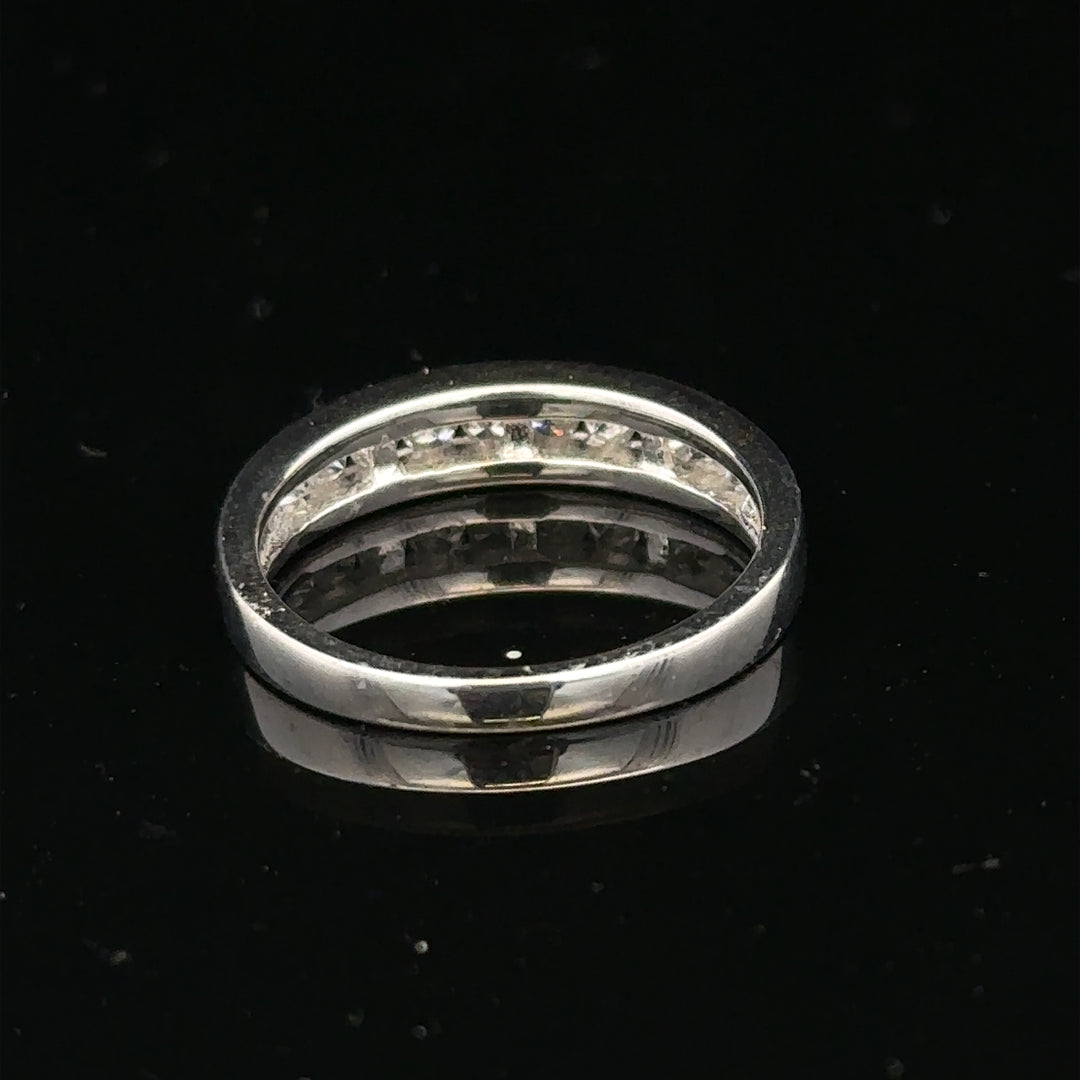 18ct white gold diamond ring in size L with sparkling diamonds, showcasing elegant jewelry design and craftsmanship.