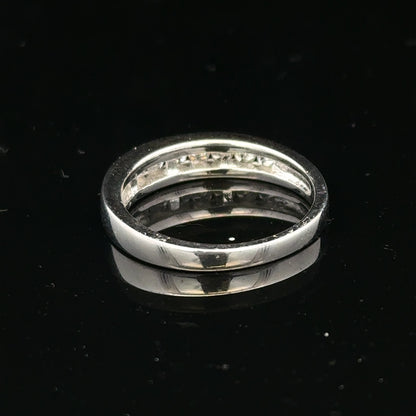 18ct white gold diamond ring in size L with sparkling diamonds, featuring a sleek, elegant design by Un.