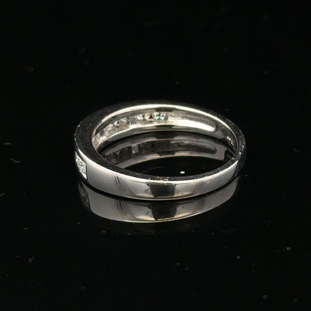 18ct white gold diamond ring in size L with sparkling diamonds, showcasing elegant jewelry design.