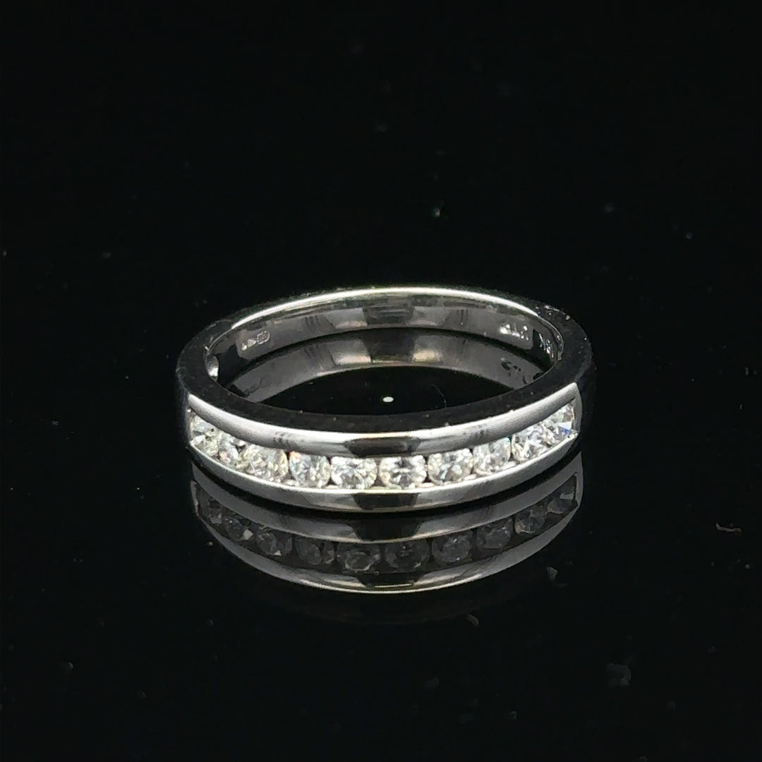 18ct white gold diamond ring in size L featuring sparkling diamonds, from Un, showcasing elegant jewelry design.