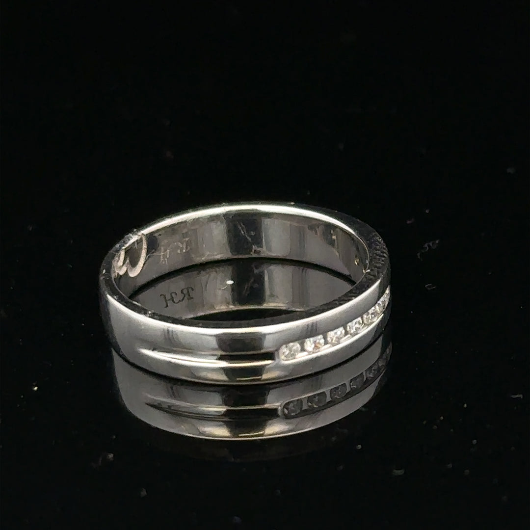 9ct white gold diamond ring with 0.20 carats, size M, featuring a sparkling central stone and elegant band design.