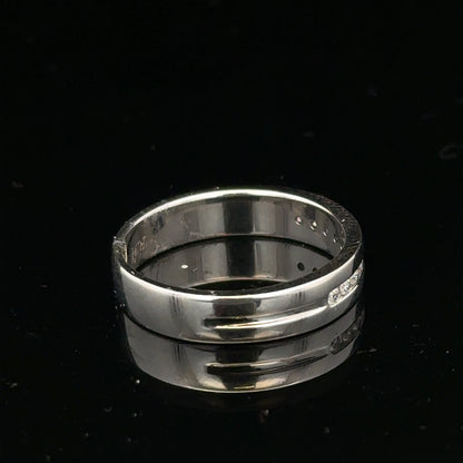 9ct white gold diamond ring with 0.20 carats, size M, showcasing a sparkling central diamond and elegant band design.