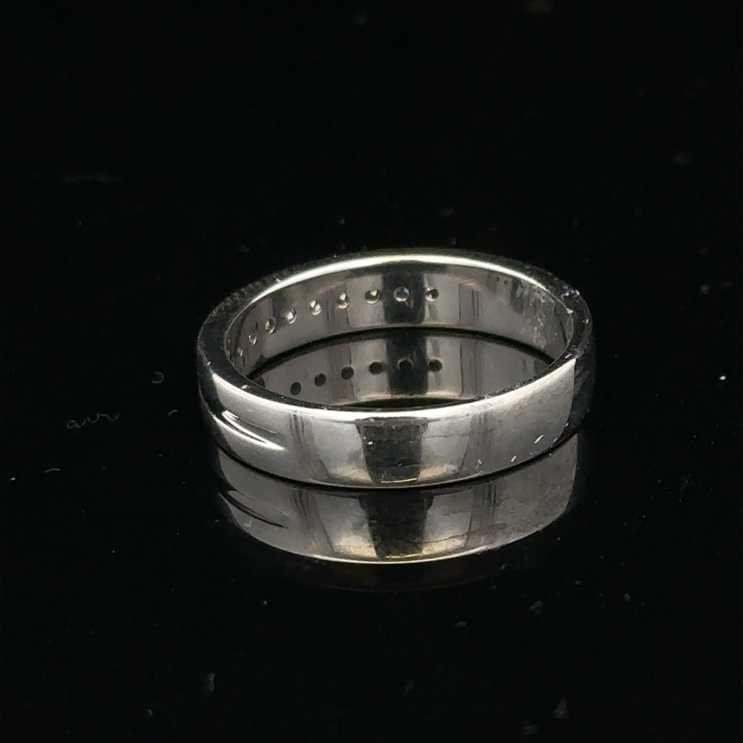 9ct white gold diamond ring with 0.20 carats, size M, featuring a sparkling central diamond on a sleek band.