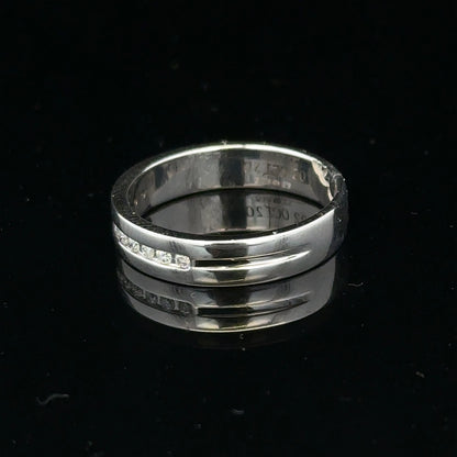 9ct white gold diamond ring with 0.20 carats in size M, featuring a polished band and sparkling diamonds.
