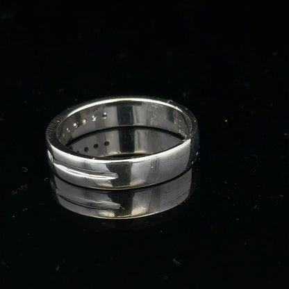 9ct white gold diamond ring with 0.20 carats, size M, featuring a sparkling diamond setting and a sleek band design.
