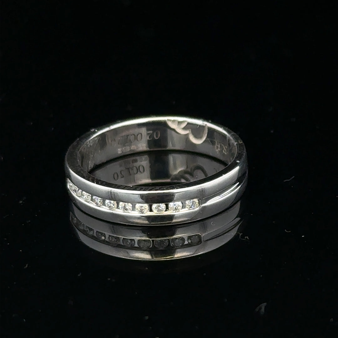 9ct white gold diamond ring with 0.20 carats, size M, featuring a sparkling central diamond and elegant band design.