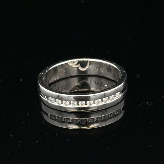 9ct white gold diamond ring with 0.20 carats, size M, showcasing sparkling diamonds and a sleek band design.