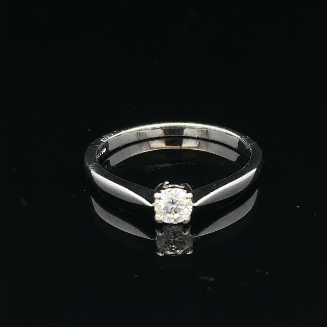 18ct white gold diamond ring in size M featuring sparkling diamonds, elegant jewelry piece with a sleek design.
