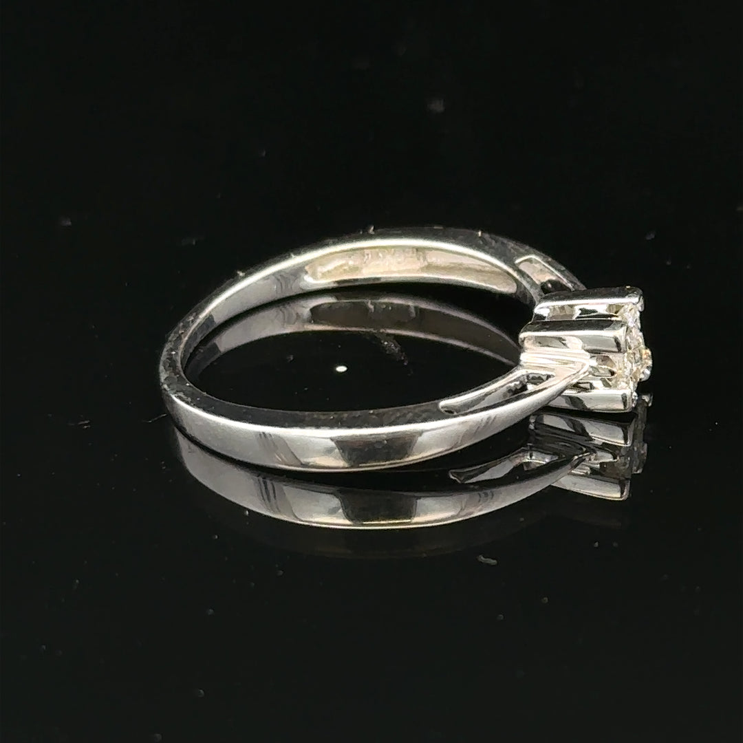 9ct white gold diamond ring with sparkling center diamond and delicate band, showcasing fine jewelry craftsmanship.
