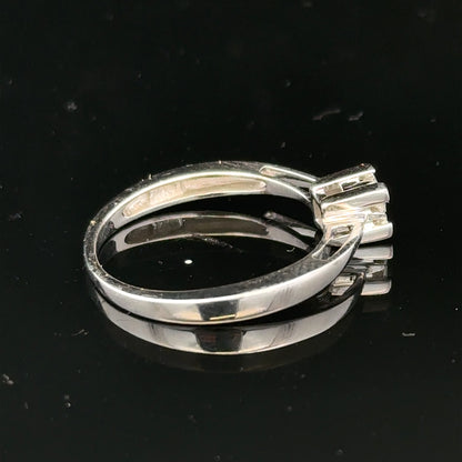9ct white gold diamond ring with sparkling stones, showcasing elegant craftsmanship and a sleek, polished finish.