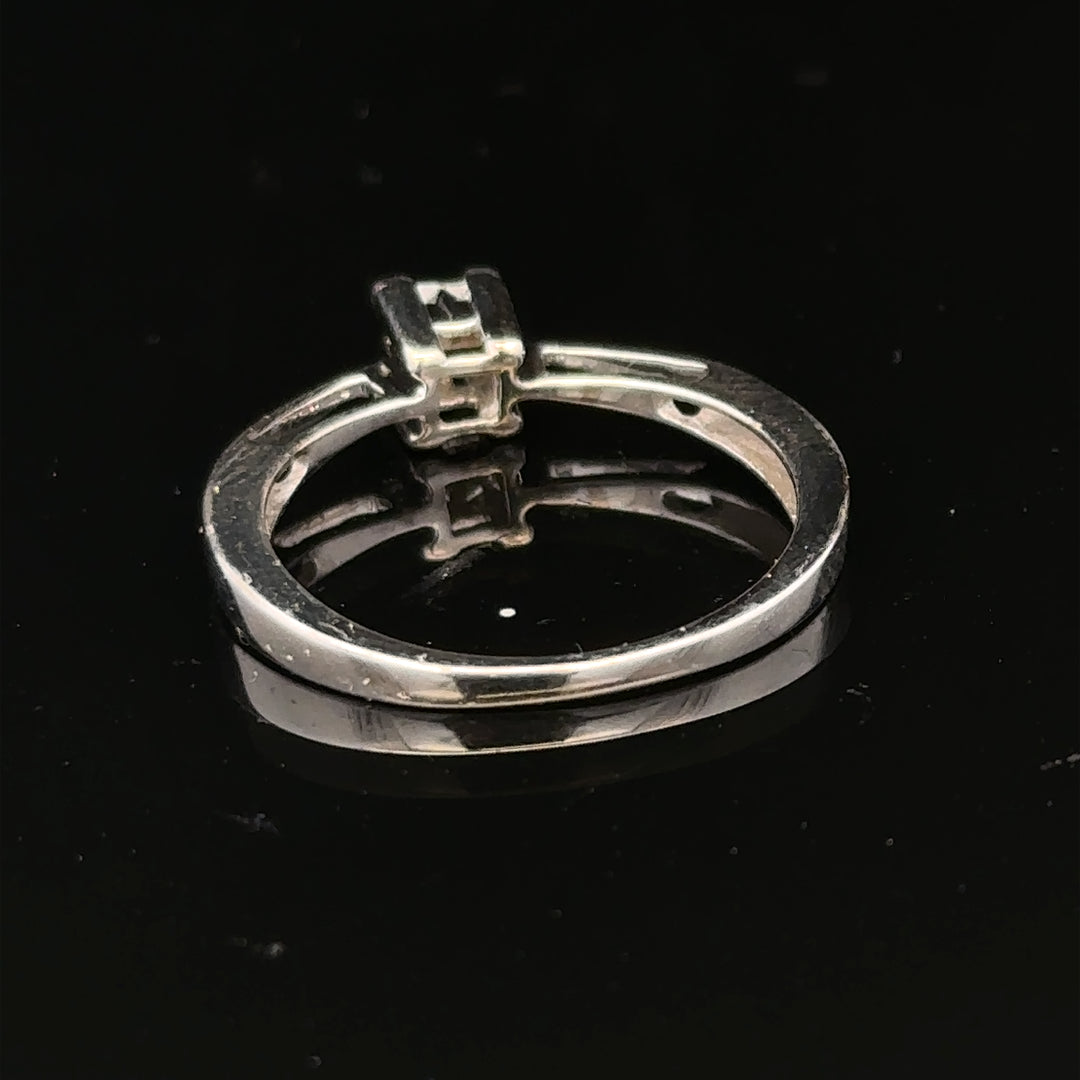 9ct white gold diamond ring with sparkling diamonds set in a sleek design, showcasing elegance and craftsmanship.