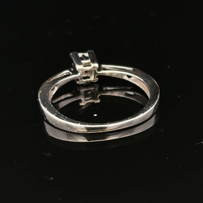 9ct white gold diamond ring with sparkling diamonds set in a sleek design, showcasing elegance and craftsmanship.